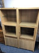 A pair of contemporary display cabinets in an oak finish.