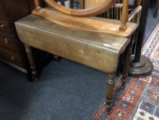 A 19th century mahogany flap sided table.