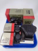 A Canon A-1 camera body together with a Canon A-1 camera case, a Canon 28mm F/2.