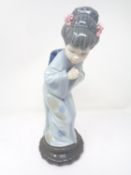 A Lladro figure - Bowing geisha.