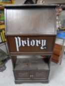 A Priory oak cabinet.