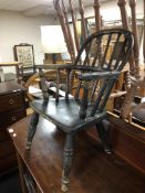 A 19th century child's Windsor armchair.