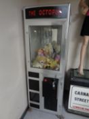 A 'The Octopus' coin operated soft toy grab machine with keys.