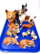A tray containing nine assorted ceramic animal ornaments including Russian tiger and lion cubs,