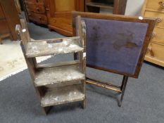 A set of folding wooden steps together with an Edwardian baize topped folding card table.