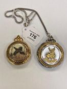 Two decorative modern pocket watches, together with an old camera.