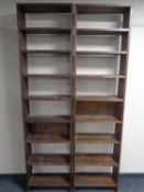 A pair of antique pine open bookshelves.