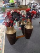 A mahogany bevel edged mirror together with two contemporary vases containing flowers.