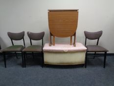 A loom blanket box together with a teak effect drop leaf kitchen and a set of three 1970s dining