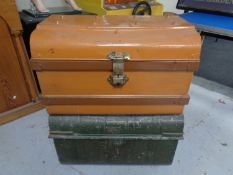 Two antique tin trunks.