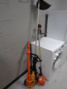 A JCB petrol strimmer together with a Flymo Lite XLT 250 + petrol strimmer and Flymo Contour