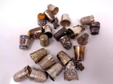 A quantity of silver thimbles and five silver plated thimbles including enamelled examples.