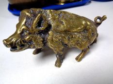 A heavy brass ornament of a wild boar.