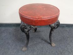 A pub stool on cast iron legs.