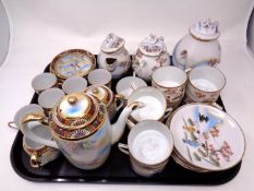 A tray containing two Japanese eggshell tea services.
