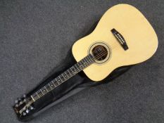 A Lindo model LDG-42N acoustic guitar in carry bag.