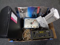 A box of Silver Crest laminator with pouches, HP printer,