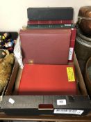 A box containing six albums and files containing 20th century world stamps as well as loose stamps.