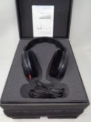 A set of Sennheiser HD600 headphones (boxed).