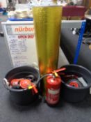 A Nürburgring white board together with two plastic buckets,