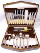 An oak canteen of Walker & Hall cutlery.