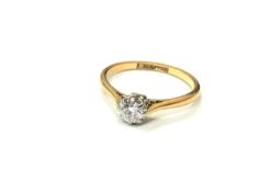 An 18ct gold and platinum diamond solitaire ring, size J CONDITION REPORT: 1.
