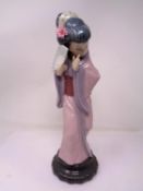 A Lladro figure - Shy geisha.