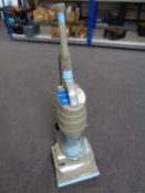 A Dyson DC 01 upright vacuum.