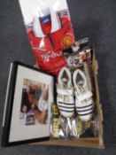 A box containing sporting memorabilia including a pair of boots signed by Stewart Broad,
