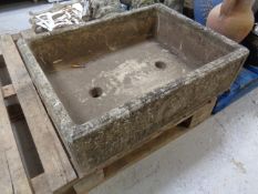 A concrete garden trough