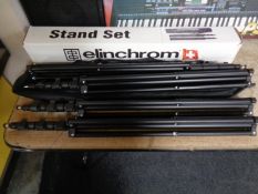 Two Elinchrom twin tripod stands (one with carry bag and box).