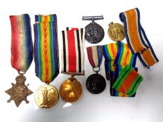 A George VI coronation souvenir tin containing three WWI medals comprising 1914-15 Star,