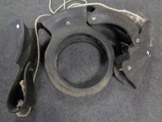 A tyre swing in the form of a horse.