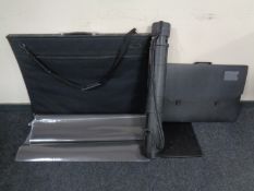 Three artist's folio cases together with an artist's tube.
