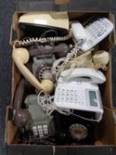 A box of Rotary dial and buttoned telephones