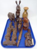 A tray containing tourist carvings.