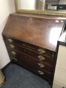 A Georgian mahogany fall front bureau with four drawers
