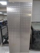 Two pieces of steel chequerboard.