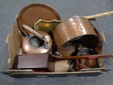 A crate containing antique and later metalware including balance scales, a kettle, cooking pot,