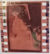 A Marilyn Monroe in Korea negative featuring Monroe in a purple dress,