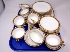 A 38-piece Aynsley white and gilt bone china tea service.
