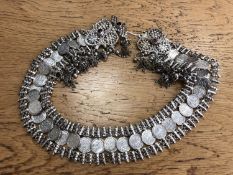 An ornate Saudi Arabian white metal belt