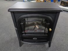 A Dimplex electric heater in the form of a log effect stove.