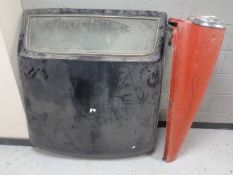 A Triumph Stag car roof together with a vintage car side panel with headlights
