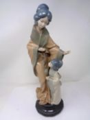 A Nao figure - Geisha with child.