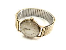 A gent's 9ct gold Lanco manual-wind wristwatch, on gilt expanding strap,