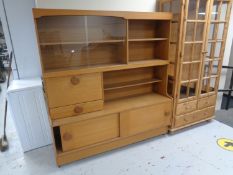 A 20th century wall unit in teak finish