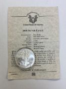 A silver USA 2008 eagle dollar, 1 troy ounce.
