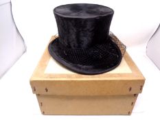 A silk top hat by Herbert Johnson of Bond street, London.