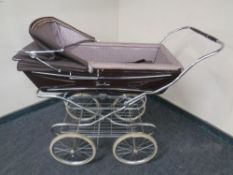 A 20th century Silver Cross coach built pram.